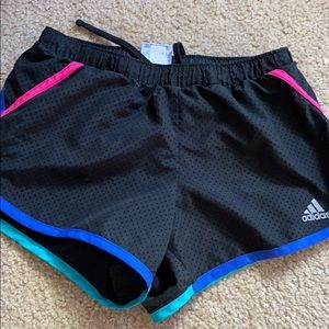 Black and teal and pink and blue shorts